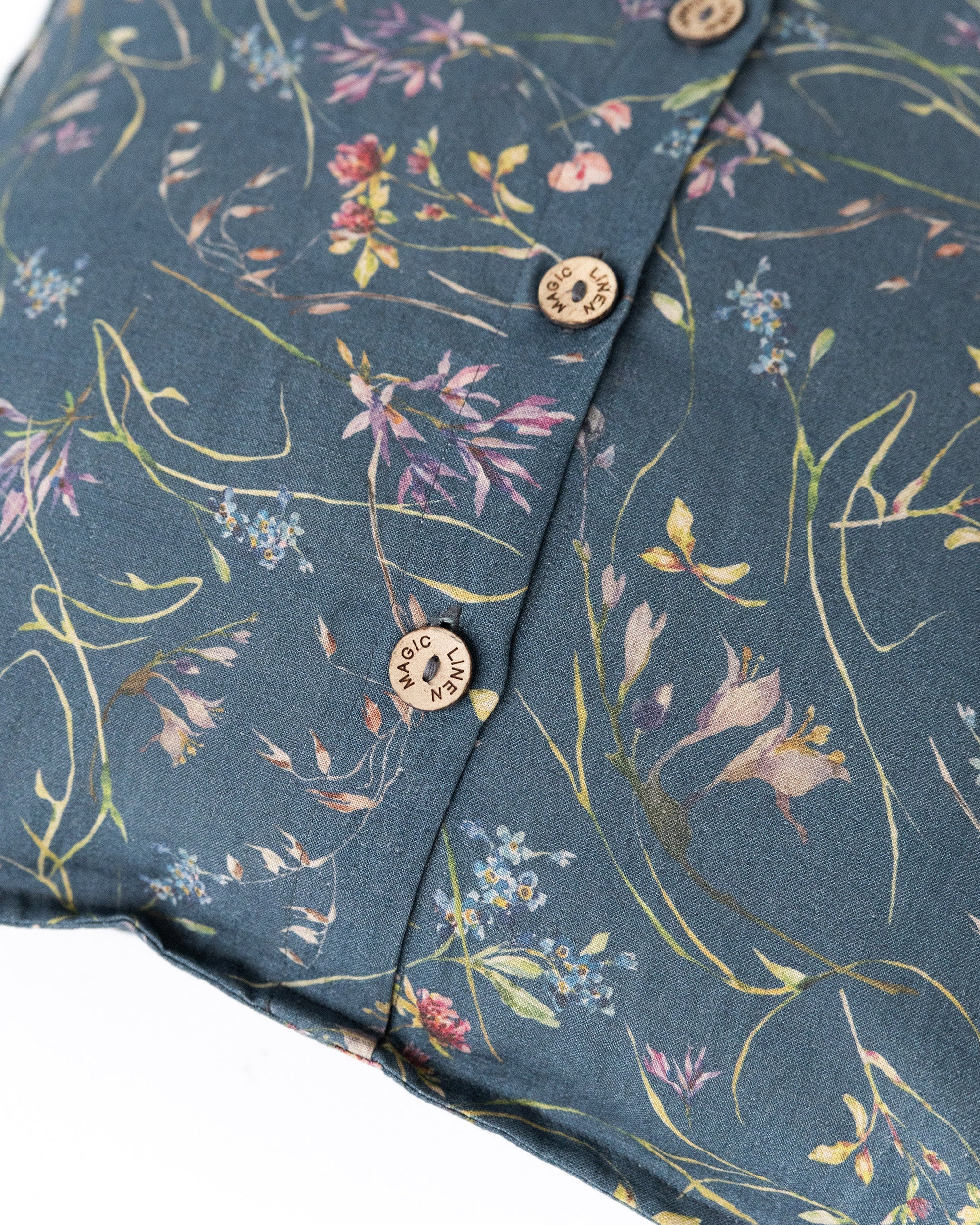 Pillow cover with buttons in Wildflowers print on deep navy blue